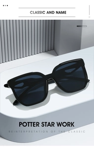 Detaillierte Nahaufnahme der schwarzen Oversize-Sonnenbrille auf modernem Display