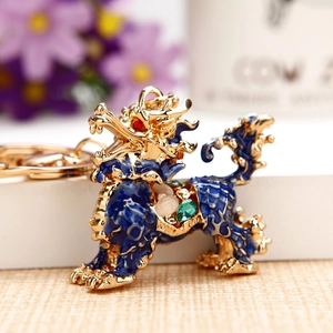 Golden Kirin keychain with blue enamel and sparkling crystals for luxury bag decor