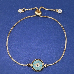 Adjustable gold evil eye bracelet with blue pavé crystals and square link chain design