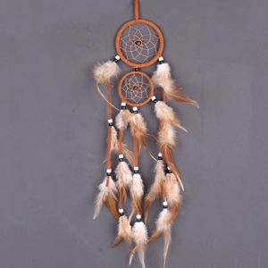 Double hoop dream catcher with orange and brown feathers and beads for wall hanging