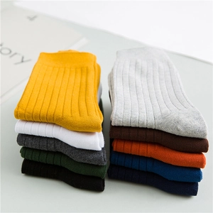 Detailed close-up of colorful ribbed cotton crew socks in a variety of vibrant colors