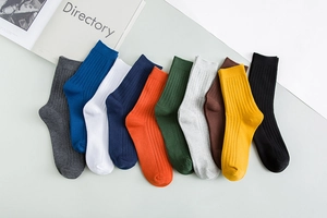Macro detail of multi-color ribbed knit crew socks arranged in a fan display