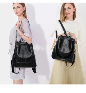 Dual view of black textured leather anti-theft backpack with adjustable straps on models