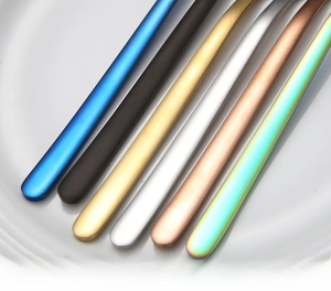 Detail of multi-color 304 stainless steel butter knives with long ergonomic handles
