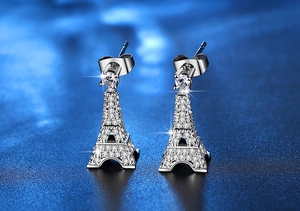 Detailed view of silver Eiffel Tower earrings with shimmering zircon stones