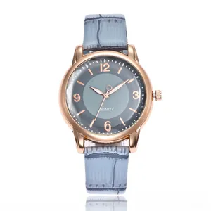 Detailed macro view of the minimalist gray dial and rose gold quartz watch hands