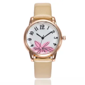 Detail view of women's quartz watch with pink floral dial and light yellow leather strap