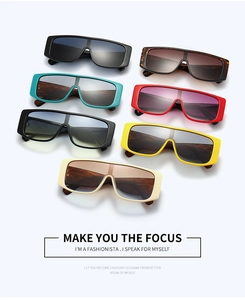 Flat lay of retro wide-frame rectangular sunglasses in seven vibrant color options