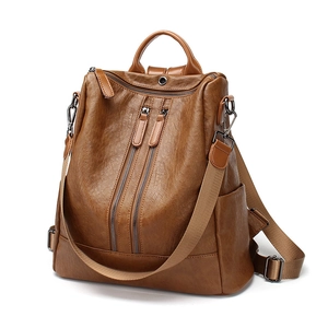 Brown soft leather anti-theft backpack for women with dual front zippers and top handle