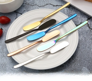 Macro detail of seamless 304 stainless steel butter knives in various PVD coating colors