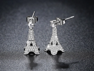 Macro shot of silver Eiffel Tower drop earrings with pavé cubic zirconia details