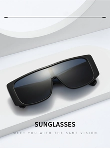 Macro shot of stylish black wrap-around rectangle sunglasses with a matte finish frame