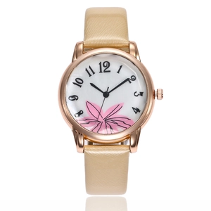 Floral print quartz watch with rose gold case and beige leather strap on white background