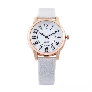 Detail of rose gold quartz watch with white glitter strap and clear numeral dial