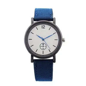 Detail of silver textured dial with blue hands and a small second sub-dial on watch