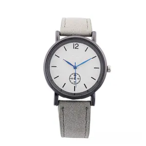 Detail of gray matte leather strap and white textured dial with vibrant blue second hand