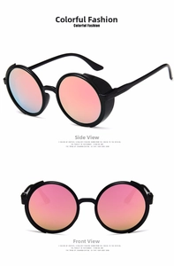 Detail view of steampunk round sunglasses with bright black frames and pink mirror lenses