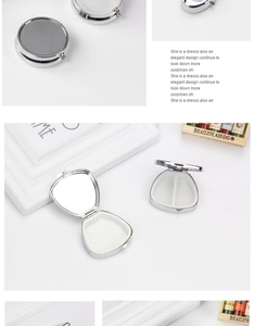 Silver metal round pill box detail featuring internal mirror and white compartment