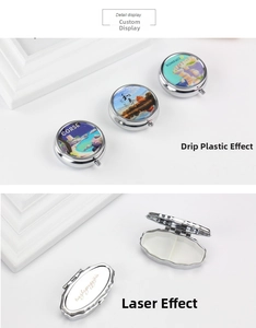 Detailed view of silver pill box showing internal dividers and custom laser engraving