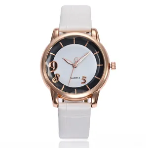 Detail of rose gold case and white leather strap on a minimalist quartz watch