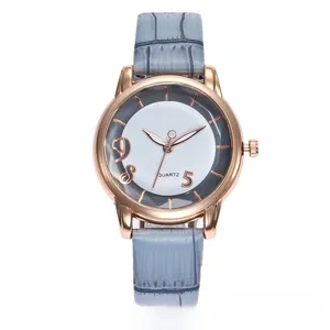 Detail view of quartz watch with rose gold case and grey crocodile leather strap