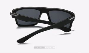 Macro view of matte black polarized sports sunglasses frame with silver DUBERY logo