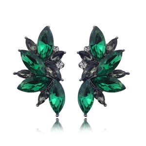Detail of leaf cluster earrings with marquise emerald green crystals in dark grey metal