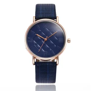 Detailed view of women's quartz watch with navy blue grid dial and rose gold metal case