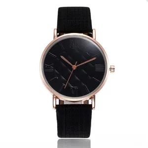 Close-up of black diamond pattern dial with Roman numerals and rose gold watch case