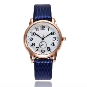 Elegant rose gold women's quartz watch with dark blue honeycomb strap and white dial