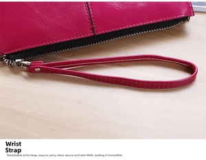 Detail of detachable wrist strap and lychee grain texture on long rose red wallet