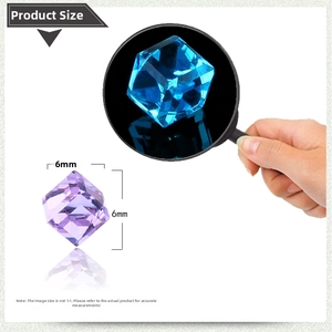 Detailed view of 6mm blue and purple cubic magnetic crystal earrings with multi-faceted cut