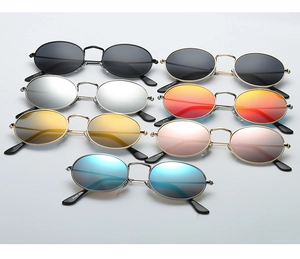 Detail view of oval metal sunglasses showing seven different lens colors and slim frames