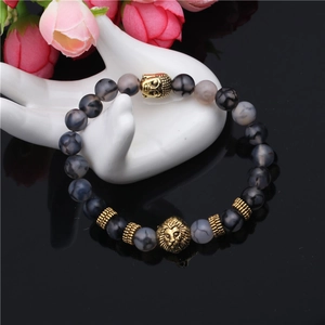 Vintage lion head and buddha bead bracelet with grey dragon vein agate stones on hand model