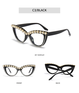 Detailed views of black cat-eye sunglasses with white pearls and rhinestone decorations