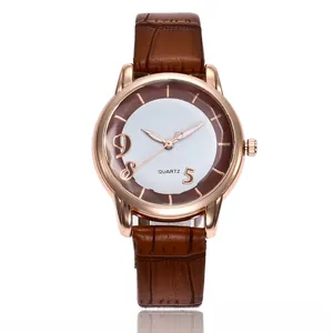 Detail of rose gold quartz watch featuring brown crocodile pattern strap and two-tone dial