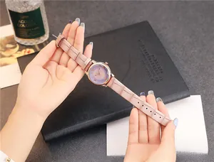 Detail showing lavender dial with rose gold case and pink faux-crocodile leather strap