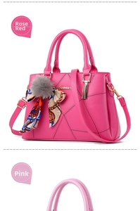 Detail of pink PU leather handbag with geometric stitching, fur pom and silk scarf