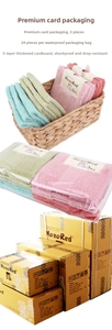 Three-pack cotton towels in pink, green, and blue with retail and bulk packaging details