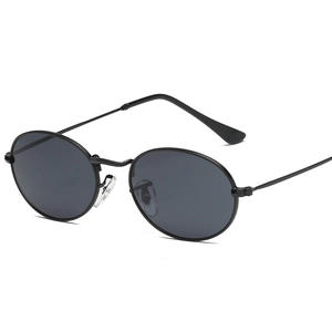 Retro oval frame sunglasses with black thin metal frames and dark grey lenses for street style