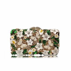 Detailed macro view of the 3D enamel flowers and crystal inlay on the metal evening clutch