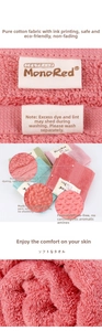 Detail of soft 100% cotton square towels in pink and beige showing the fabric texture