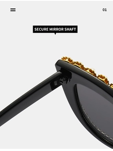 Close-up of secure metal hinge and golden flower details on cat eye sunglasses