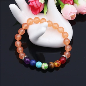 Bracelet en perles de calcédoine orange 8mm avec sept pierres naturelles de chakra