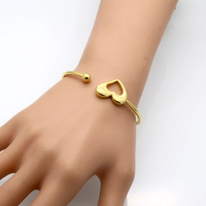 Elastic hollow heart 18K gold stainless steel open bangle with metallic sphere accent