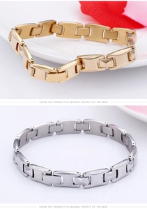 Detail of two-tone gold and silver business bracelets with brushed metal texture
