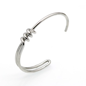 Minimalist silver bow knot open bangle bracelet with spiral metal texture in 45-degree view