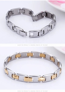 Detailed macro view of silver and gold two-tone stainless steel link bracelets for men