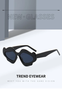 Macro shot of black wavy irregular sunglasses with trendy geometric frame design