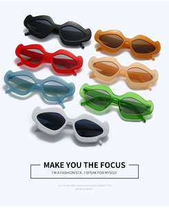 Lip-shaped sunglasses shown in multiple colors including red, black, and green